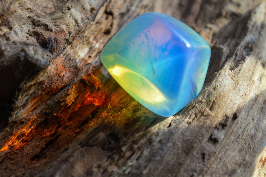 An Opalite stone on a wood