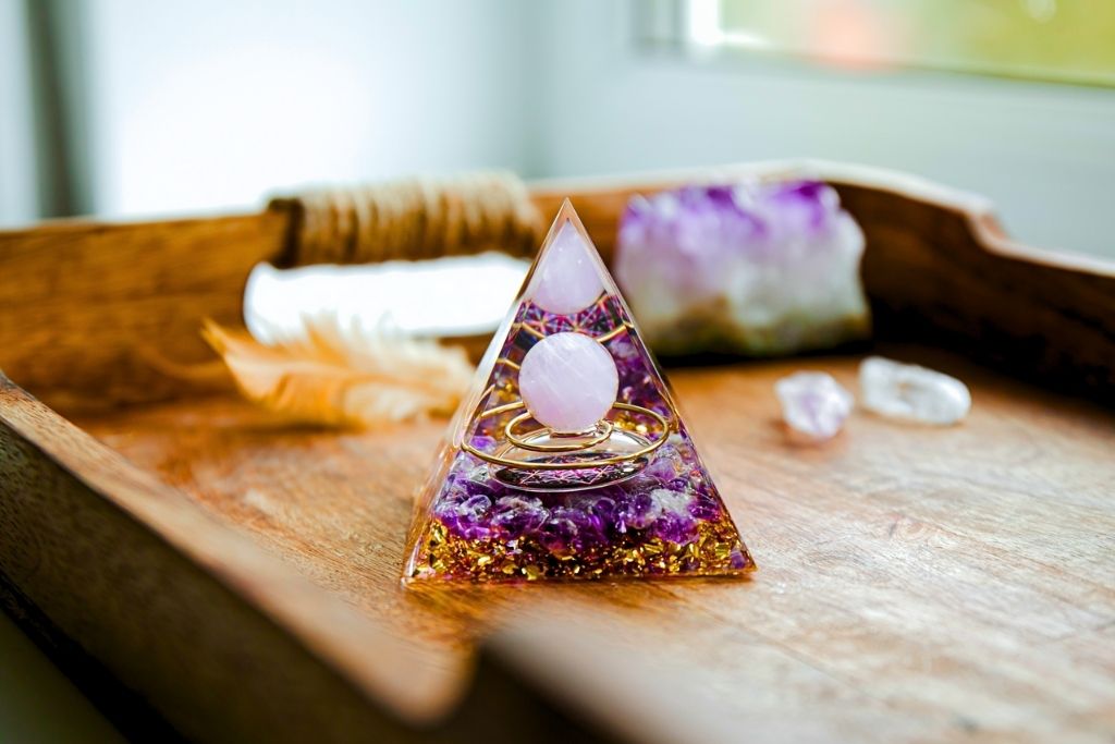 An Organite Pyramid placed on a wooden platform