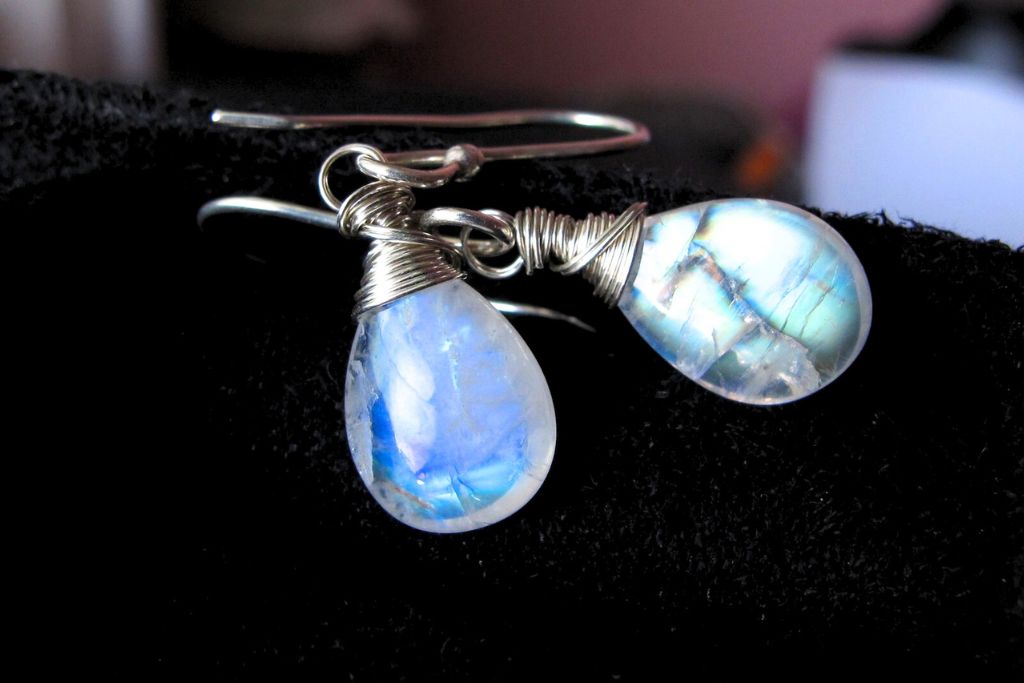 a pair of rainbow moonstone earrings. Image source: Flickr | Amelia Isa