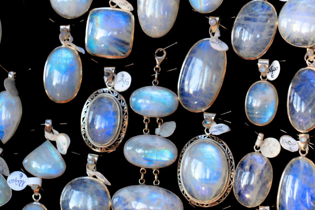 collection of rainbow moonstone crystal jewelries