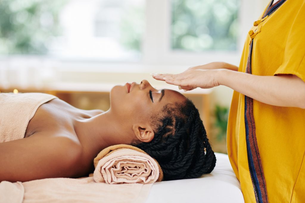 A woman in a reiki healing therapy