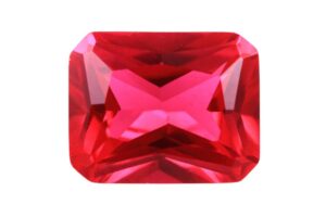 A polished Ruby crystal on a white background