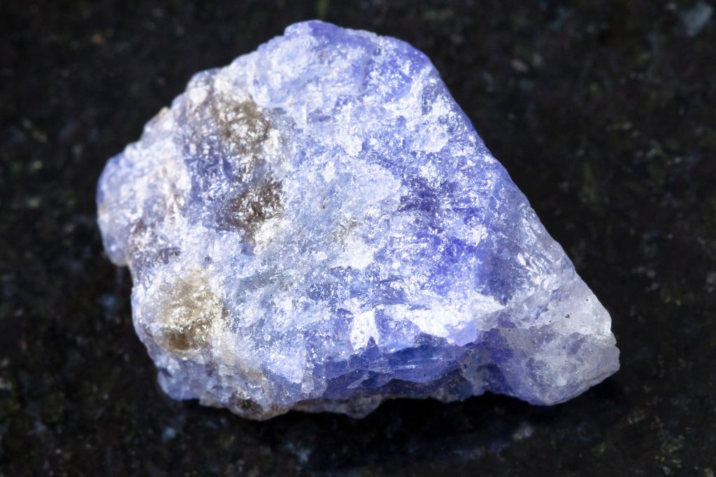 A tanzanite crystal on a black background