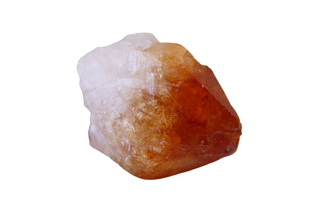 A raw topaz crystal on a white background