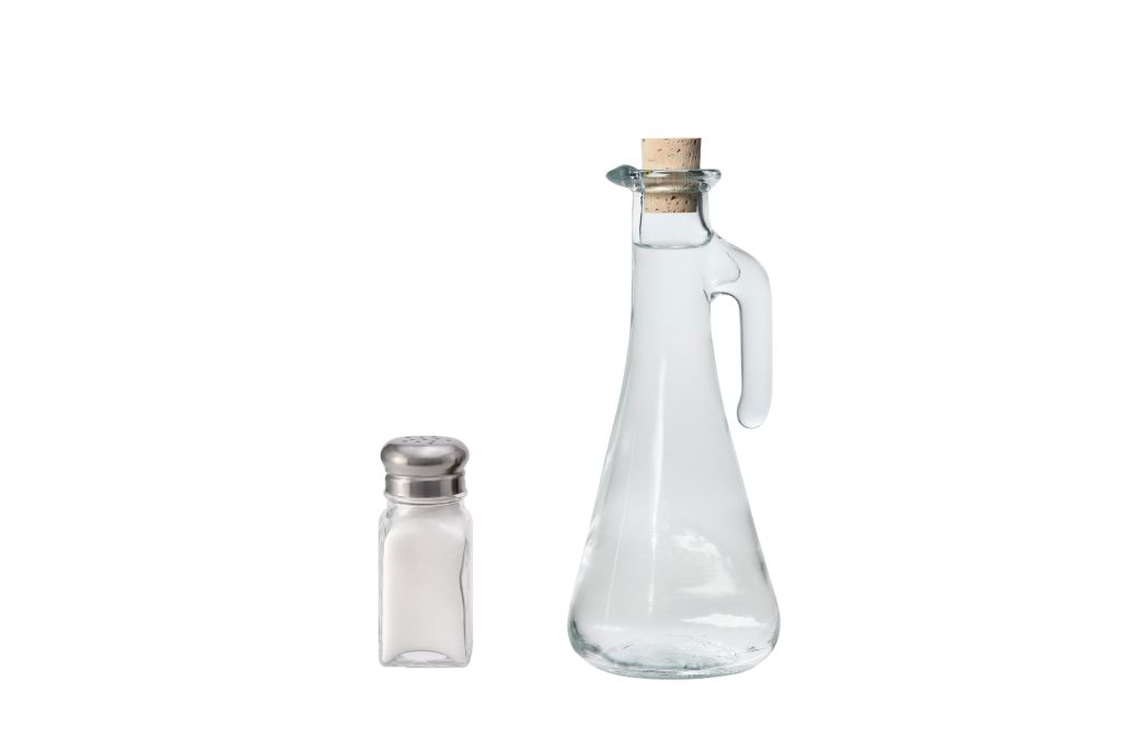 A bottle of Vinegar and Salt on a white background