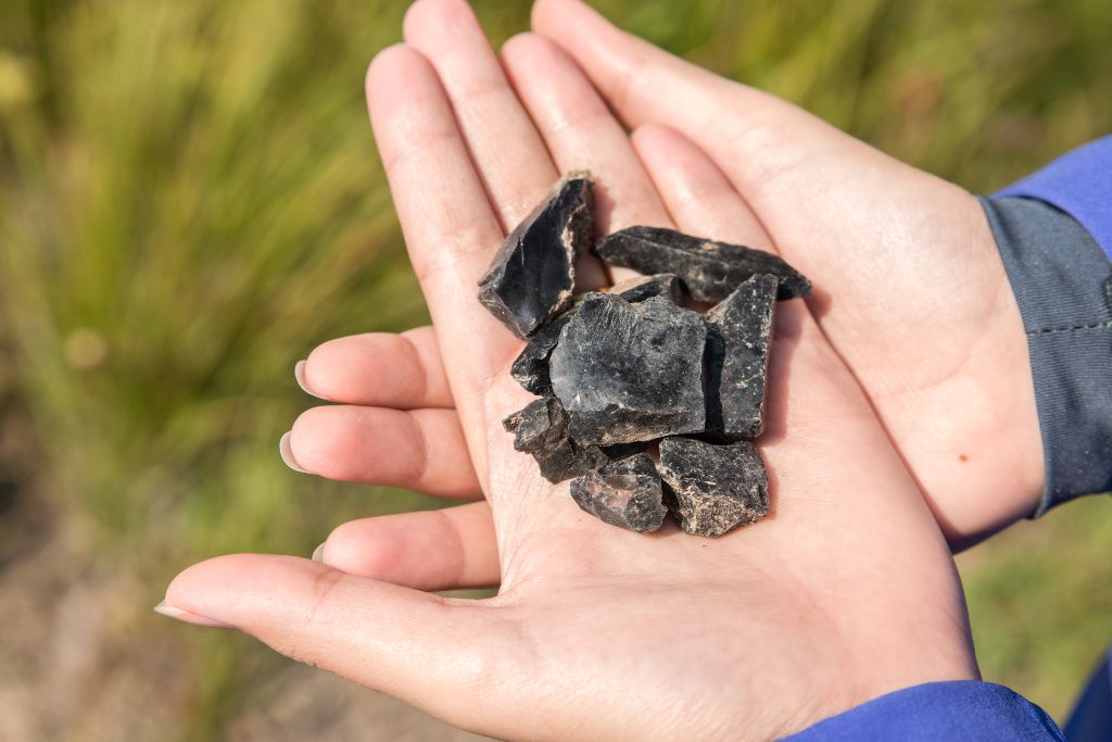 volcanic stone placed on a woman's palm