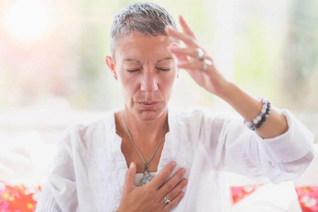 Woman doing intuition meditation hand gestures