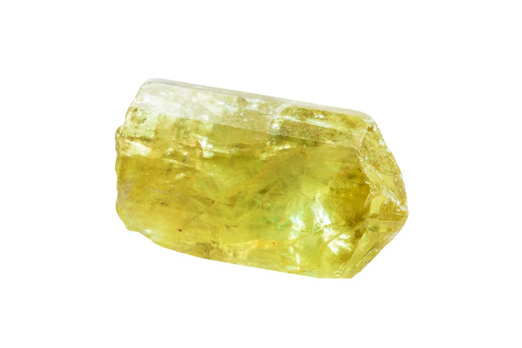 Yellow Apatite crystal on a white background
