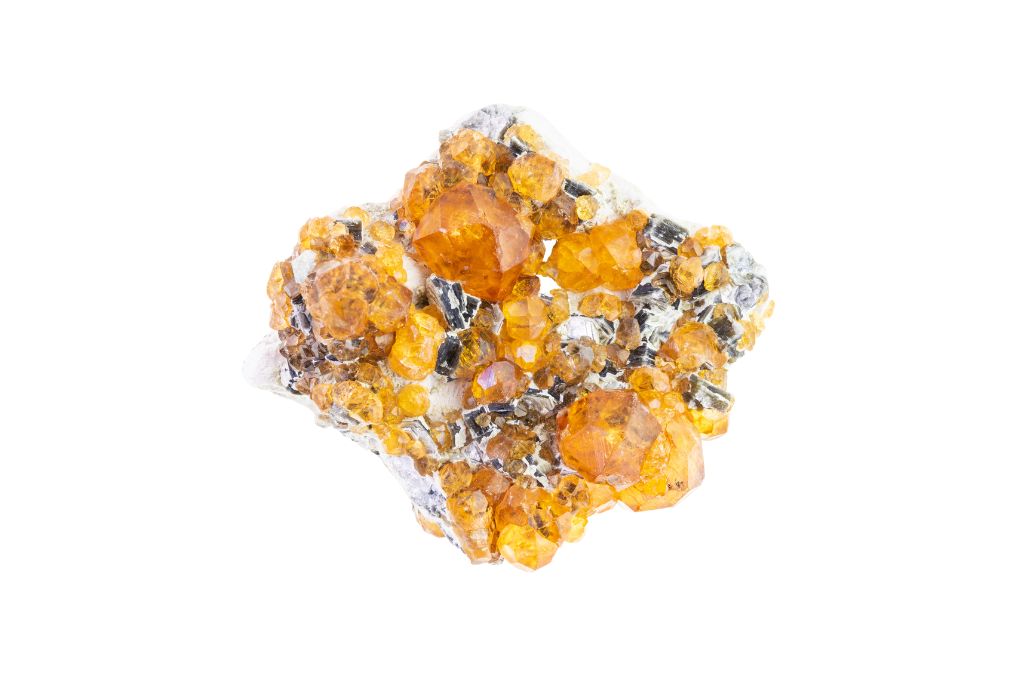 Yellow Garnet Spessartine crystal on a white background