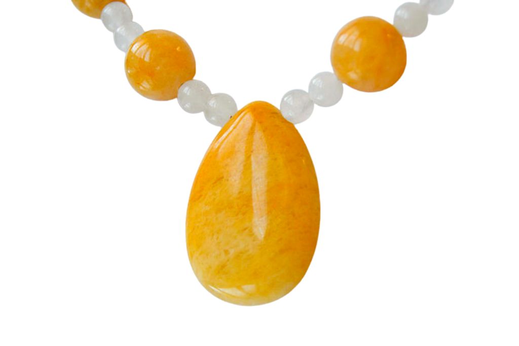 Yellow Jade crystal necklace on a white background