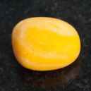 Yellow Jasper on a black granite