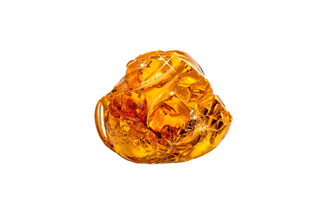 amber crystal on a white background
