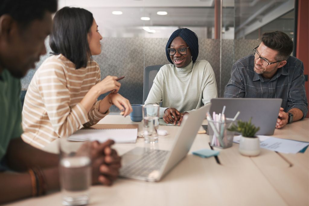 colleagues talking to each other during a meeting