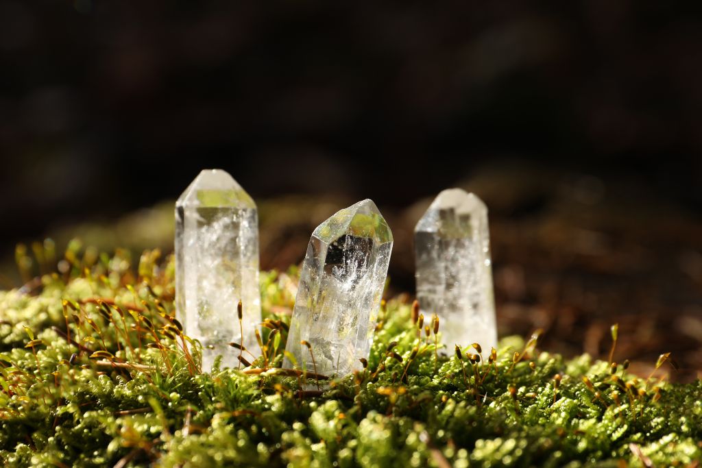Clear quartz crystal on a moss