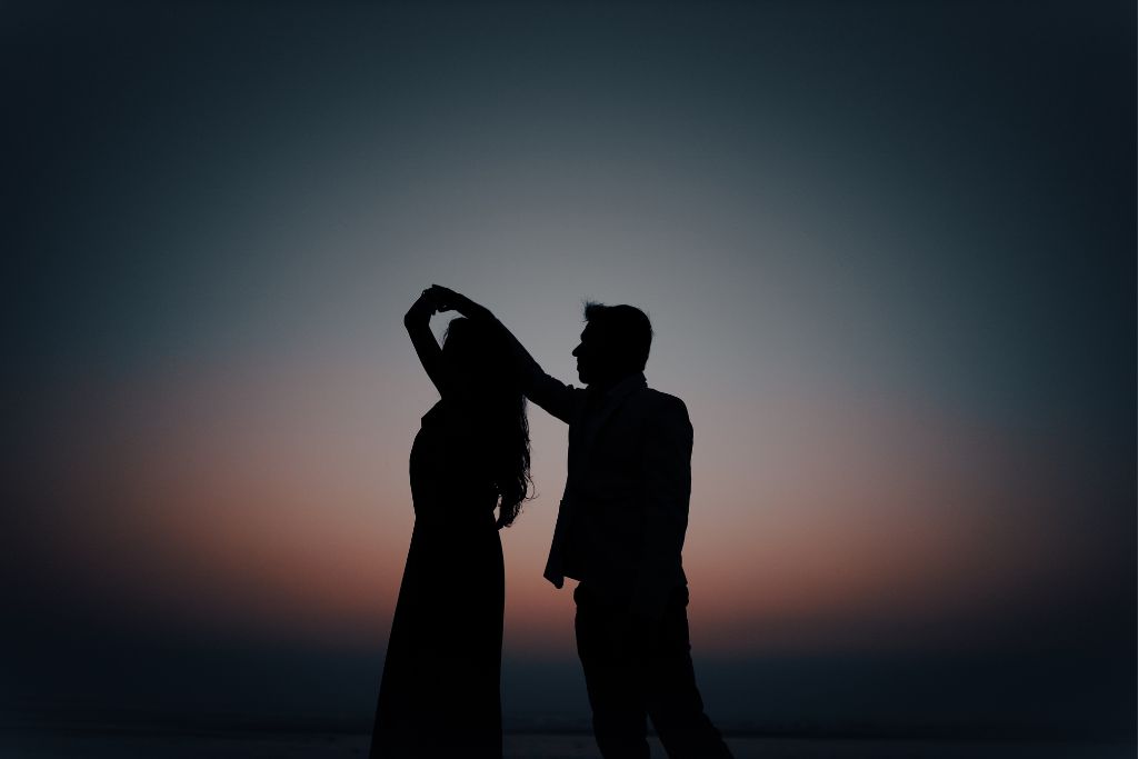 silhouette of a couple dancing during sunset