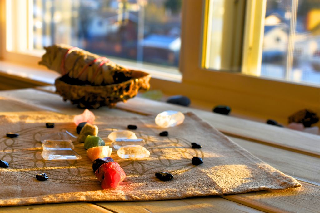 An array of crystals has been placed on a crystal grid cloth, and the crystals are being shined by sunlight.