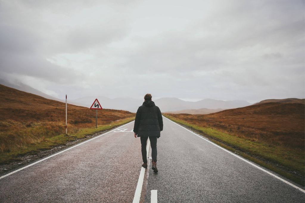 a man walking on the road