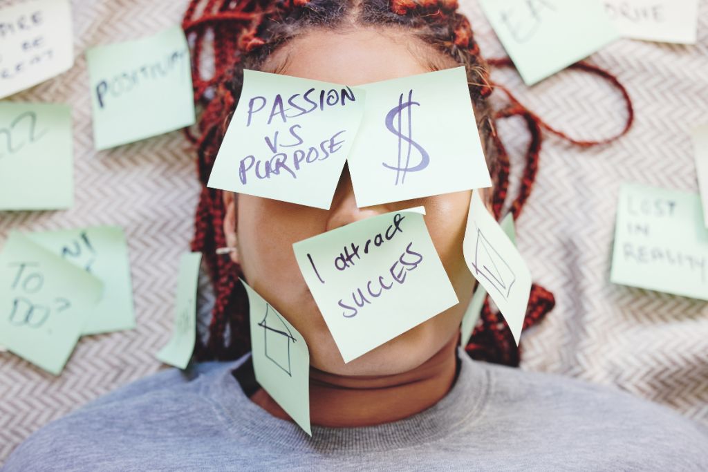 a woman with sticky notes on her face