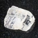 petalite crystal on a dark granite