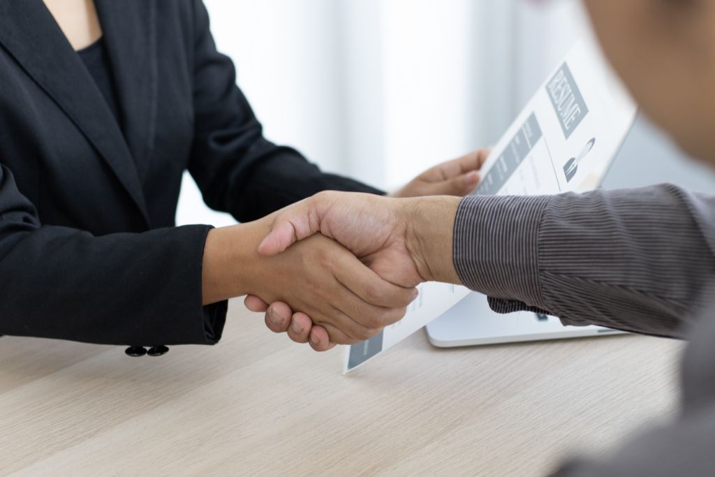 recruiter and applicant shaking hands