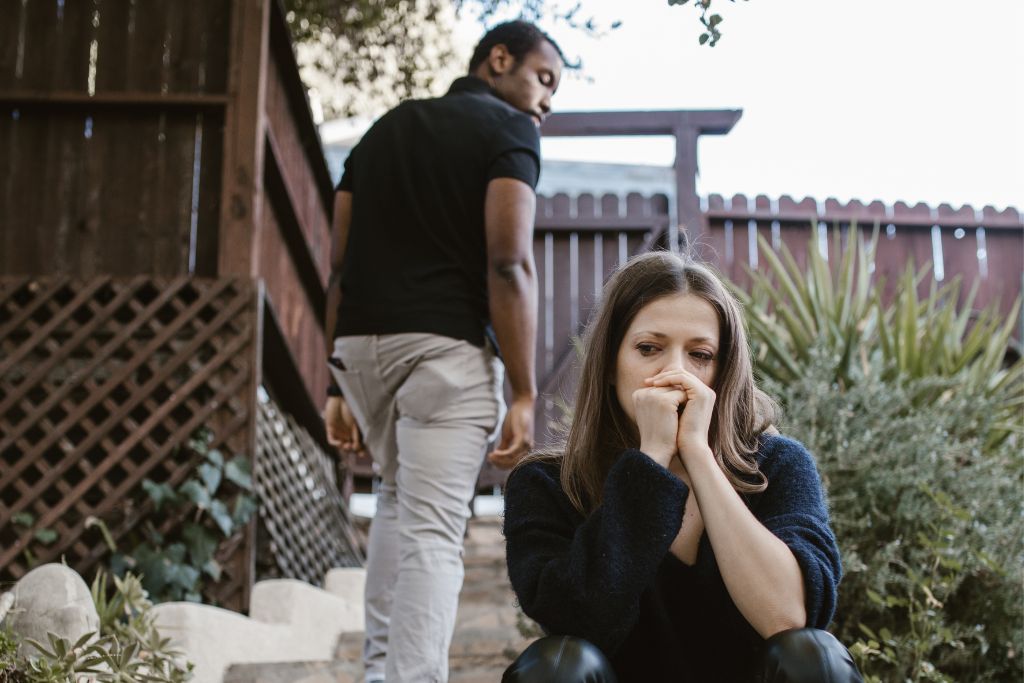 A woman, tearful and upset, left by her boyfriend