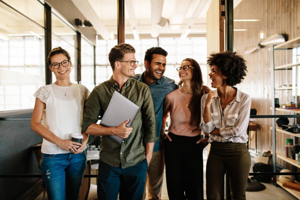 A group of people talking to each other