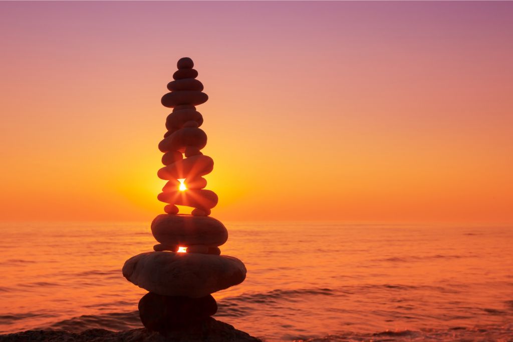 Stack of stones that are balanced near the beach