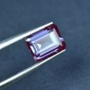 A polished Alexandrite crystal on a tweezer. Source: Etsy | BingoGem