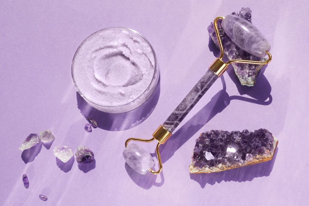 An Amethyst face roller on a purple background