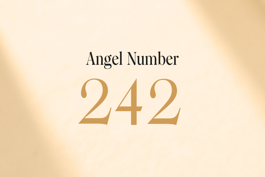 angel number 242 written on a beige background