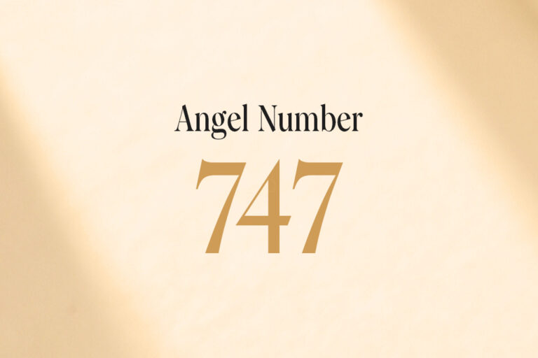 angel number 747 written on a beige background