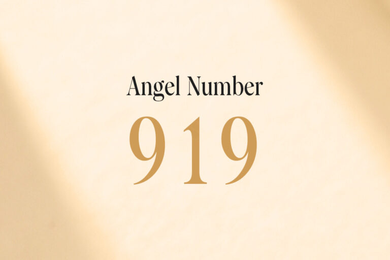 angel number 919 written on a beige background