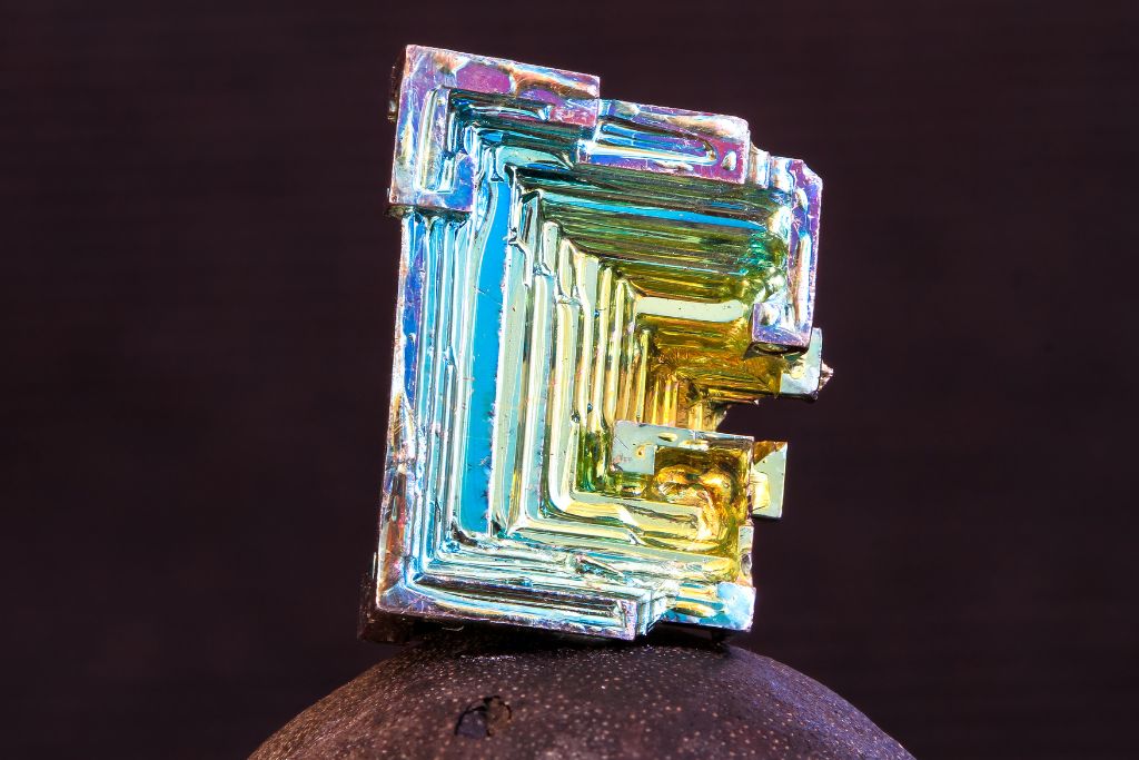 A Bismuth crystal on a rock