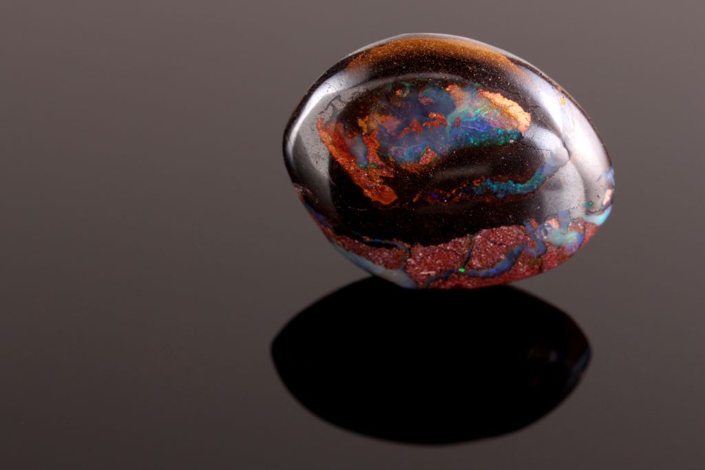 A boulder opal on a dark background