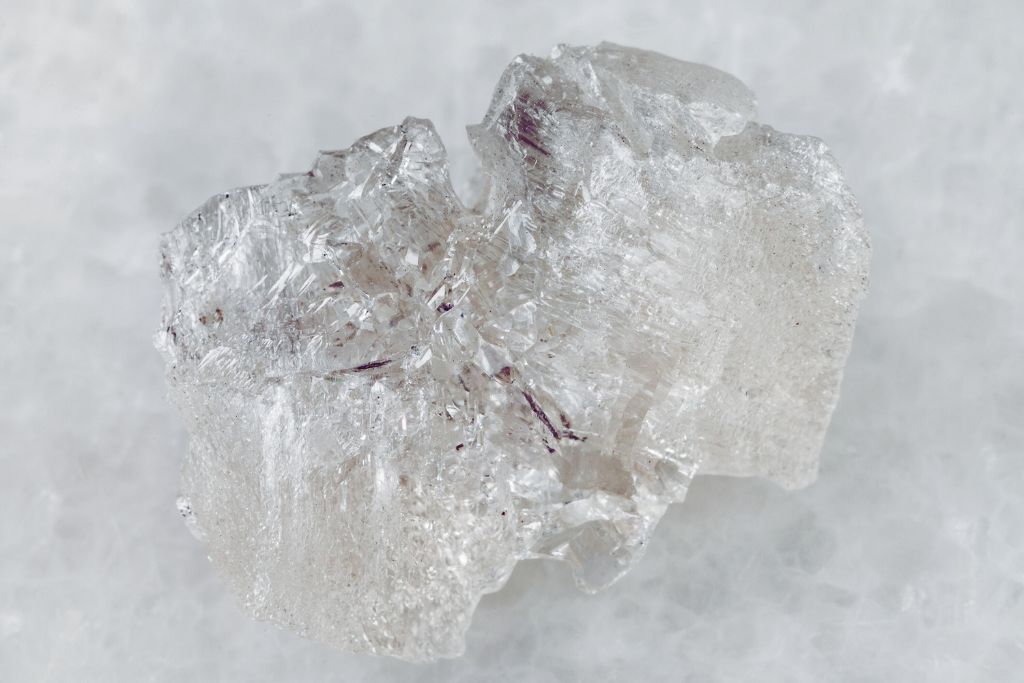 A danburite crystal on a whitish background