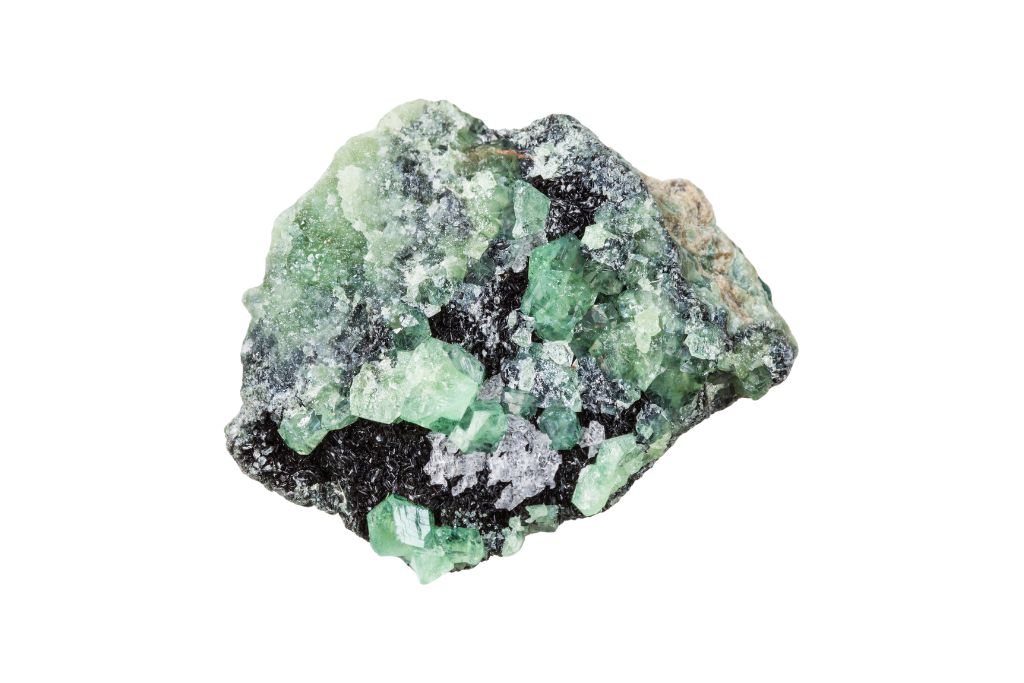 A raw Demantoid Garnet on a white background