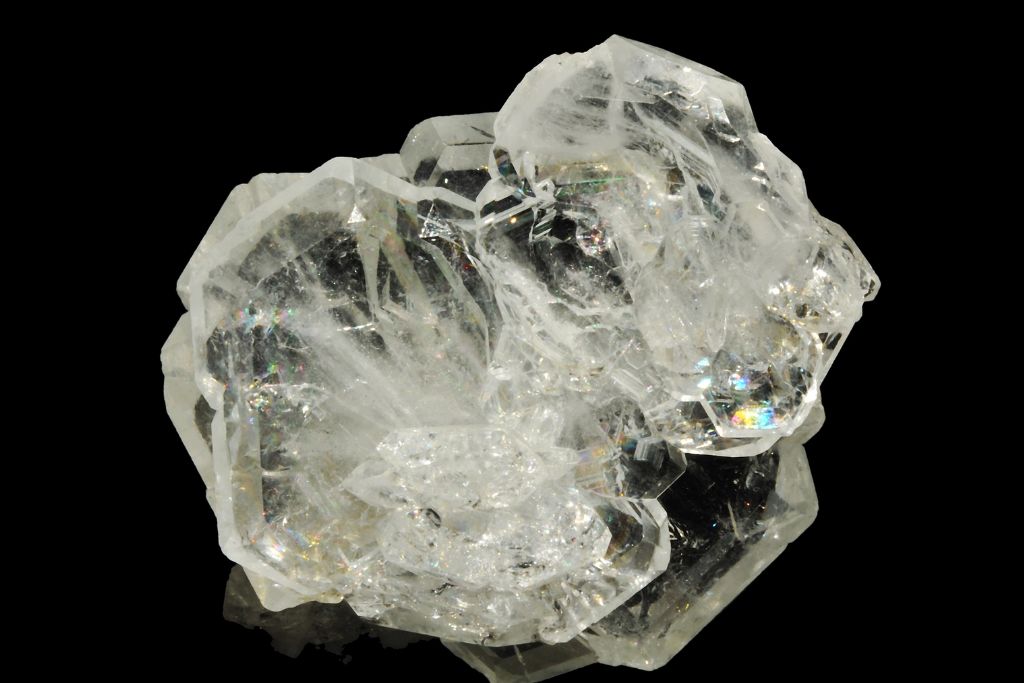 A raw Goshenite crystal on a black background. Source: Wikimedia | Géry PARENT