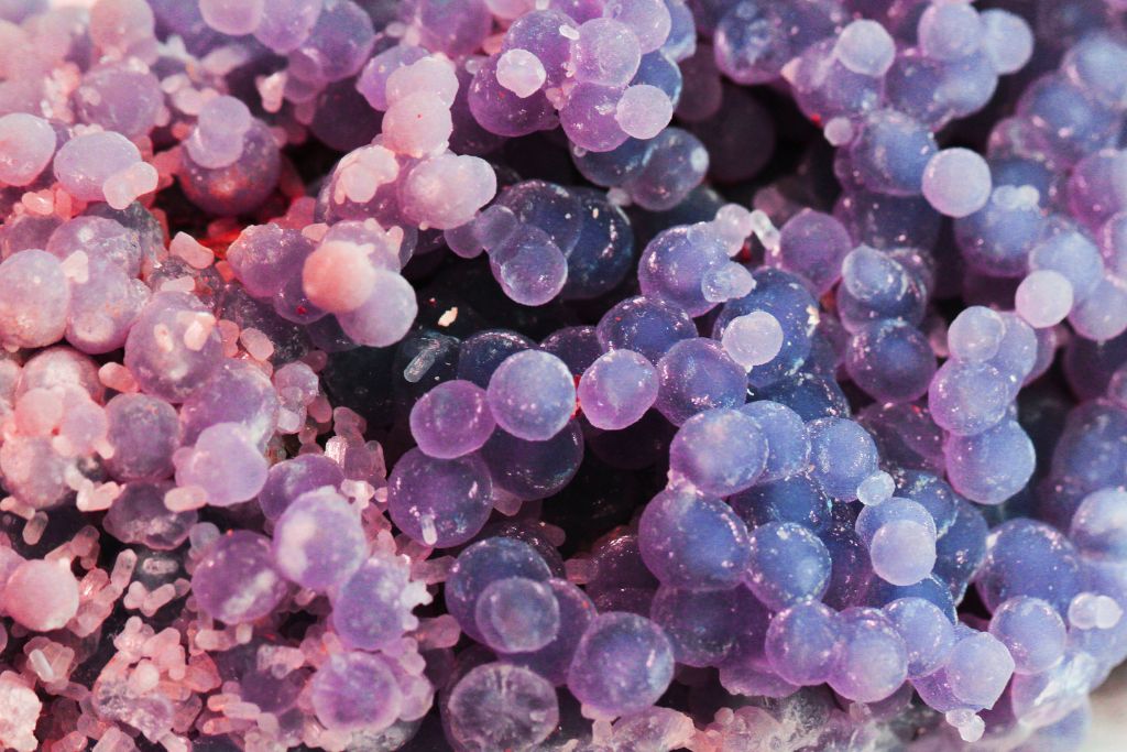 A close up shot of a grape agate crystal
