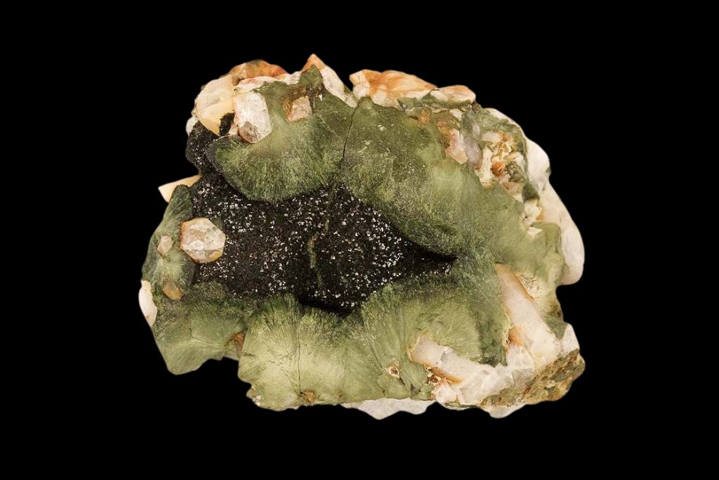 A raw Olivenite crystal on a black background. Source: Mindat.org | Robert M. Lavinsky