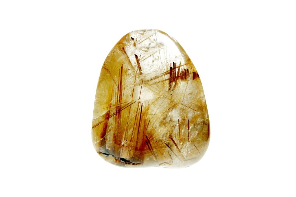 A rutilated quartz on a white background