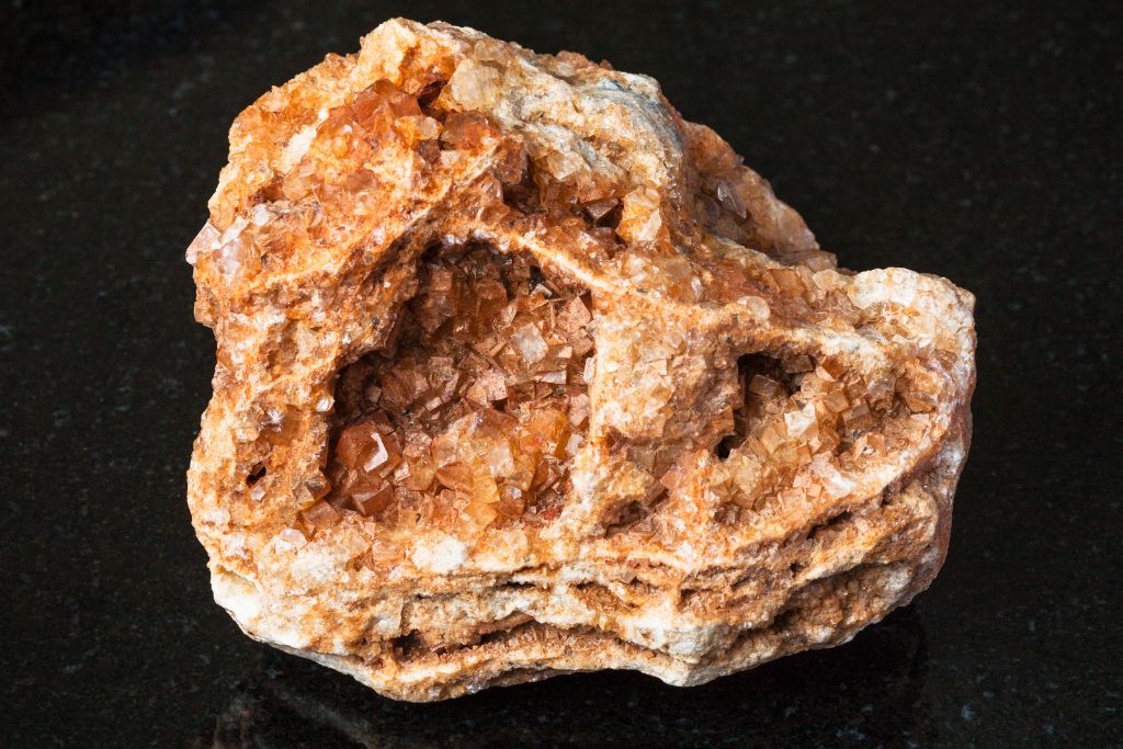 A Wulfenite crystal on a black background