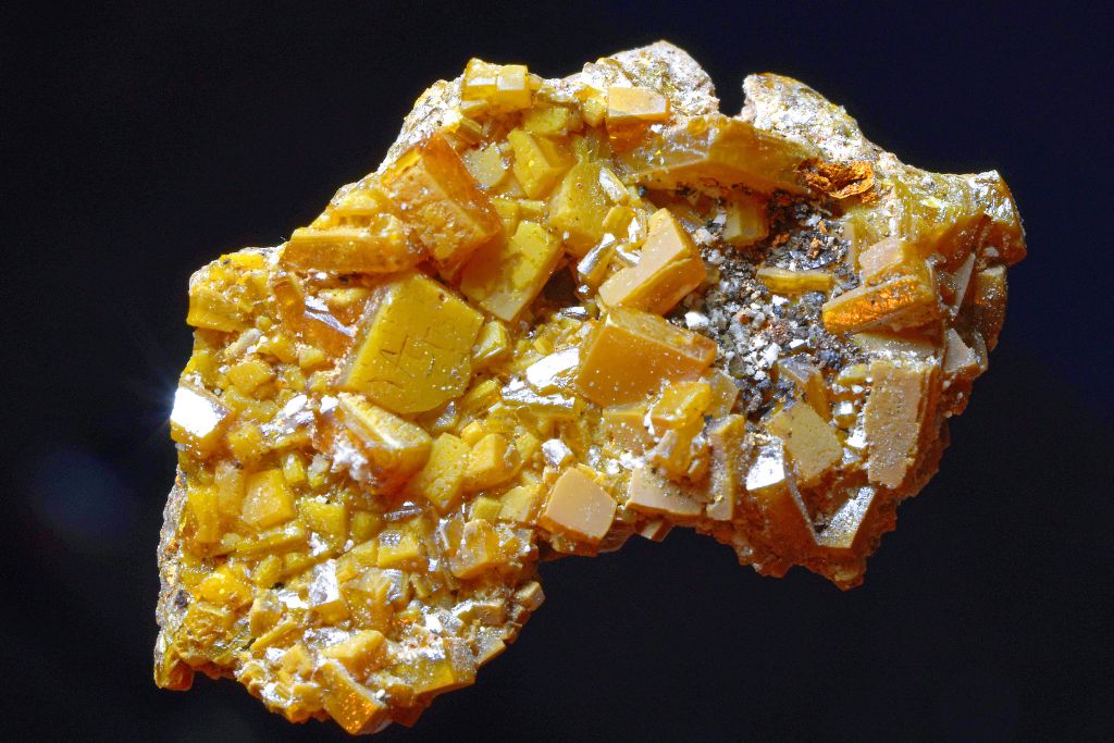 Wulfenite crystal formation on a black background