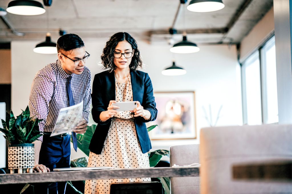 woman and man working inside their company office