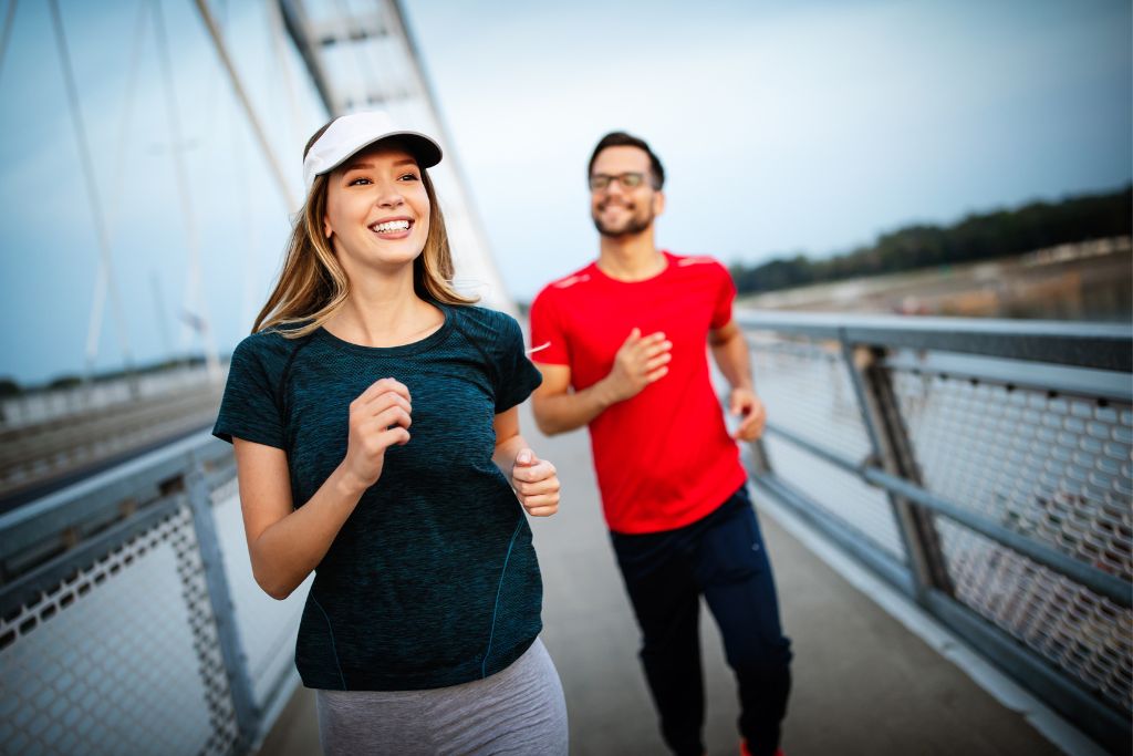 a happy couple doing an exercise run