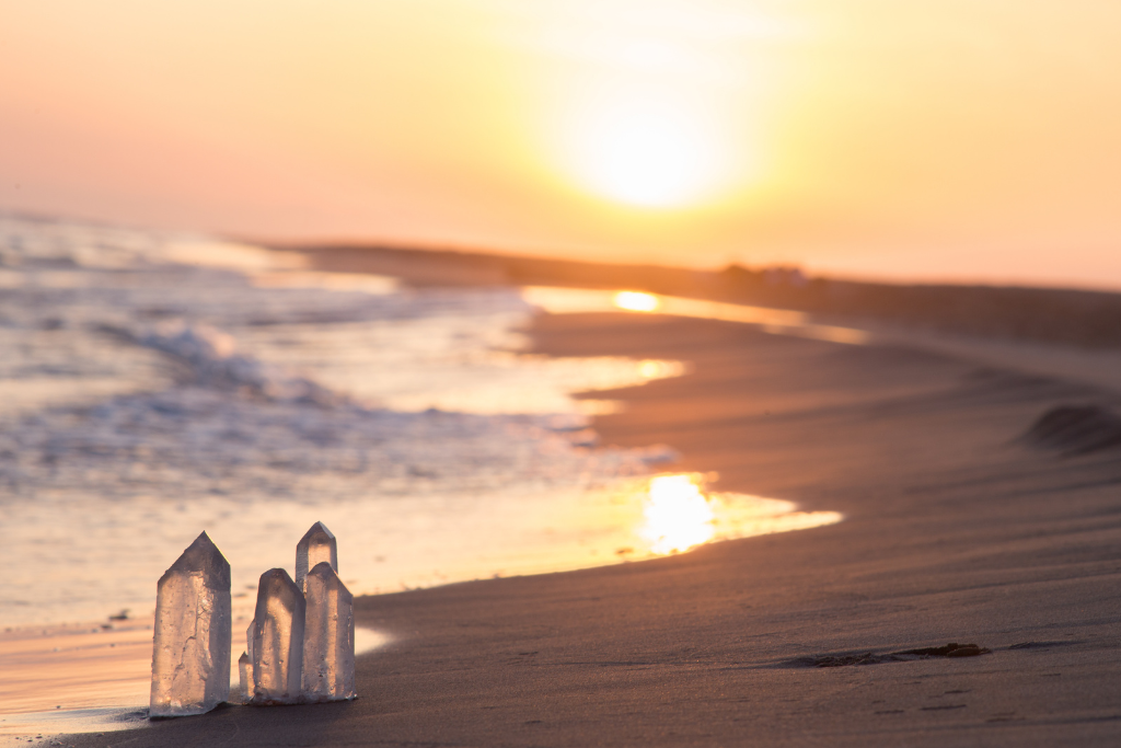 crystals on a beach during sunset