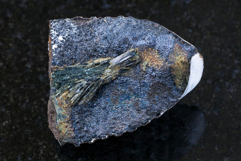 vivianite on a black granite