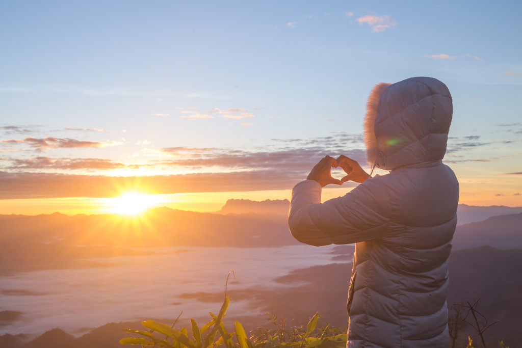 person standing on the by the sun raise 