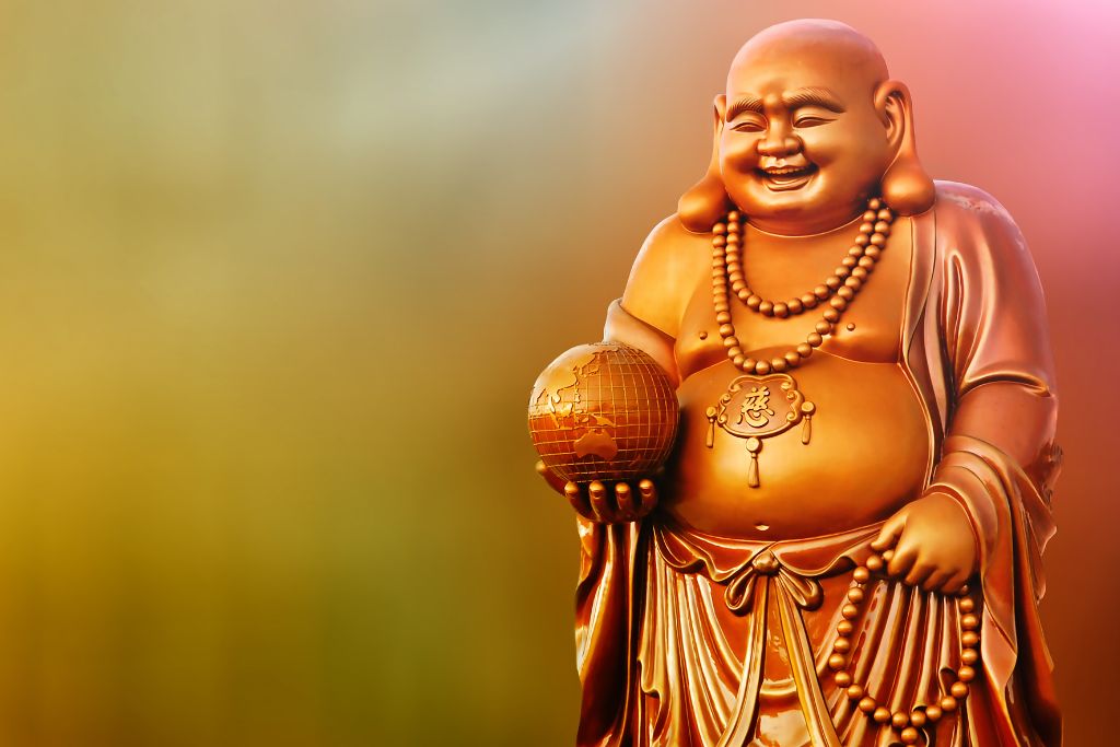 A buddha statue that is laughing