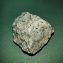 A granite rock on a green background