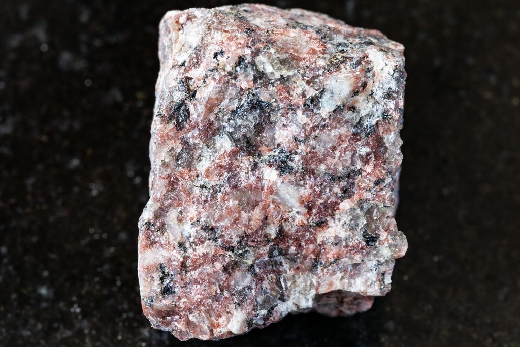 A pink granite on a black granite